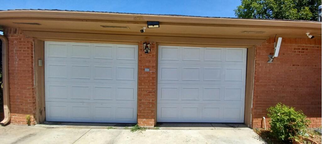New garage door installation on a brick home in Euless, TX – Euless garage door repair and replacement