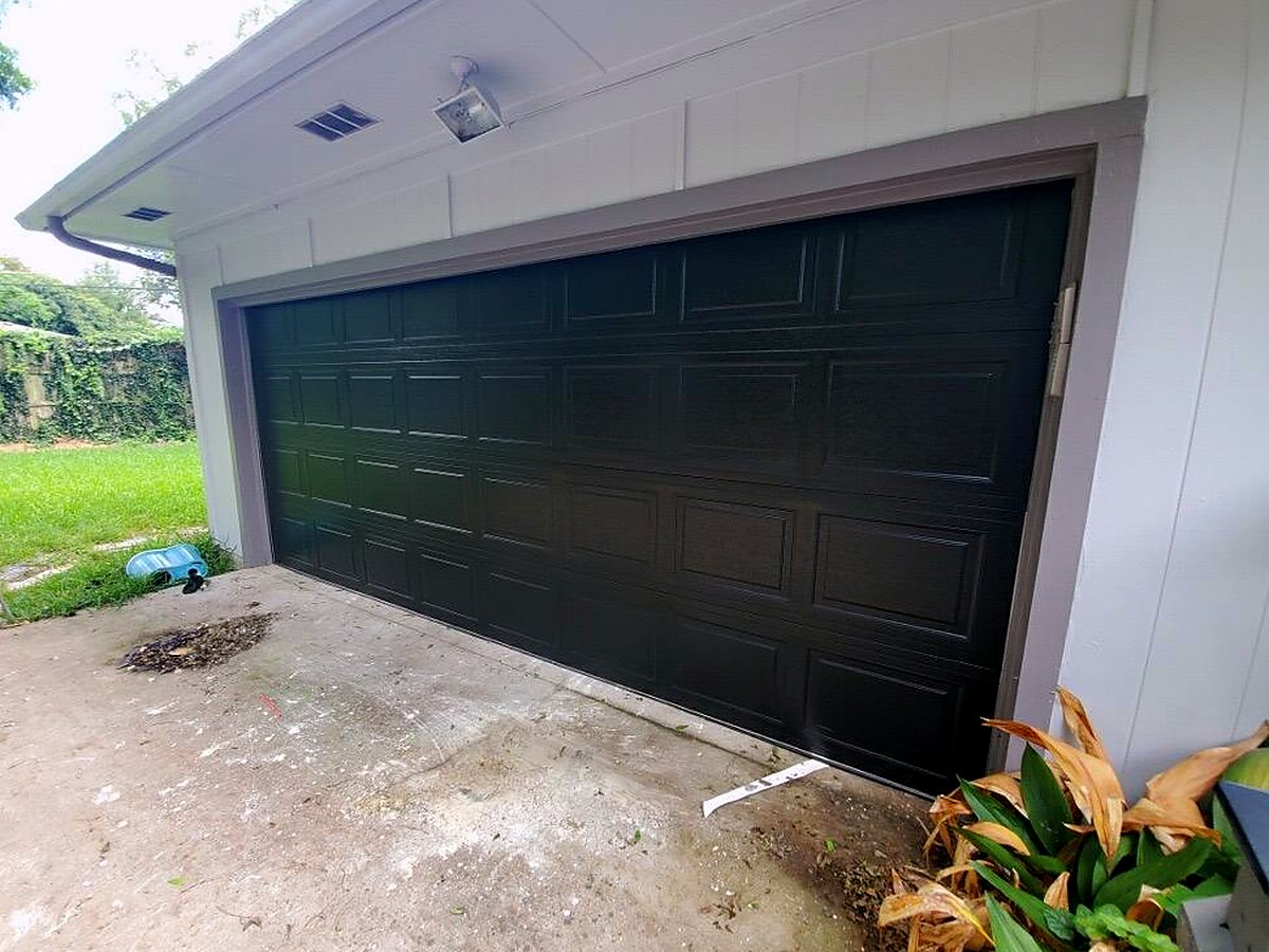 Modern black flush-panel garage door