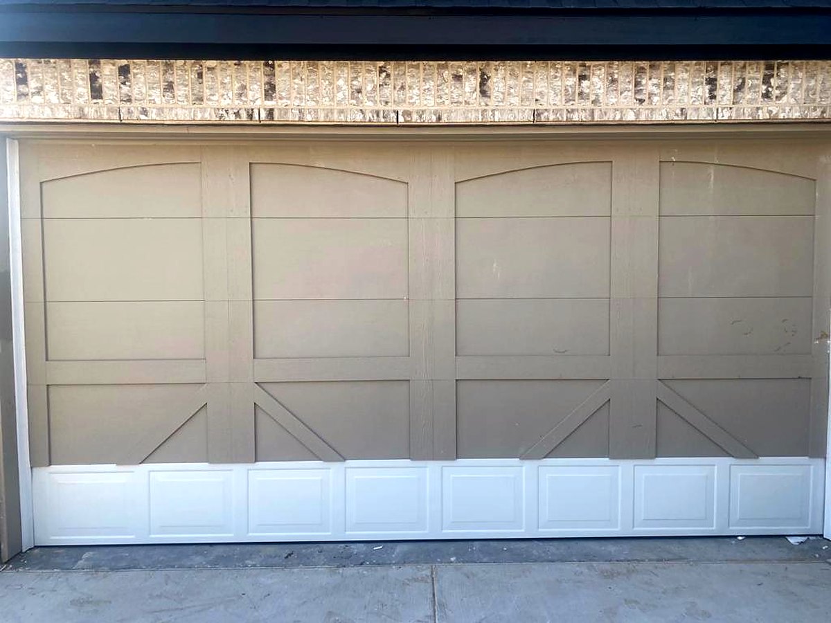 Carriage-style garage door on a stone home Carriage-style garage door on a stone home